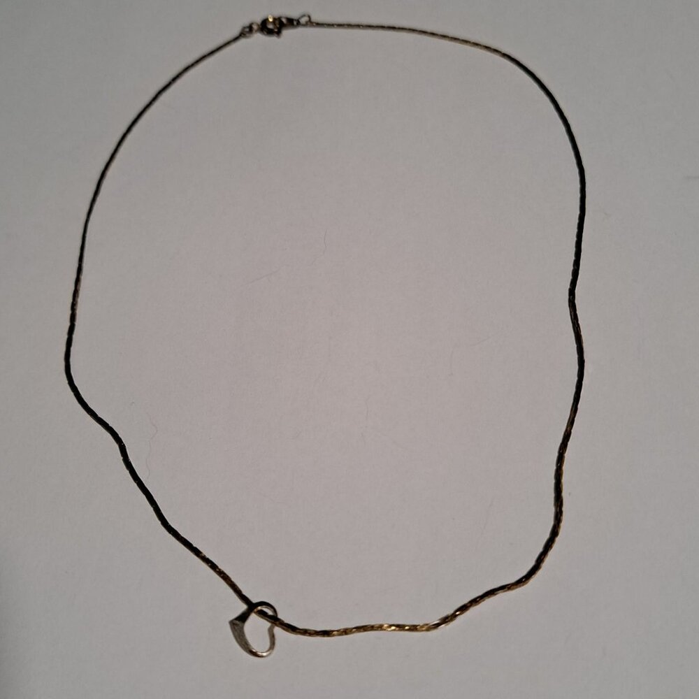 gold tone necklace with heart